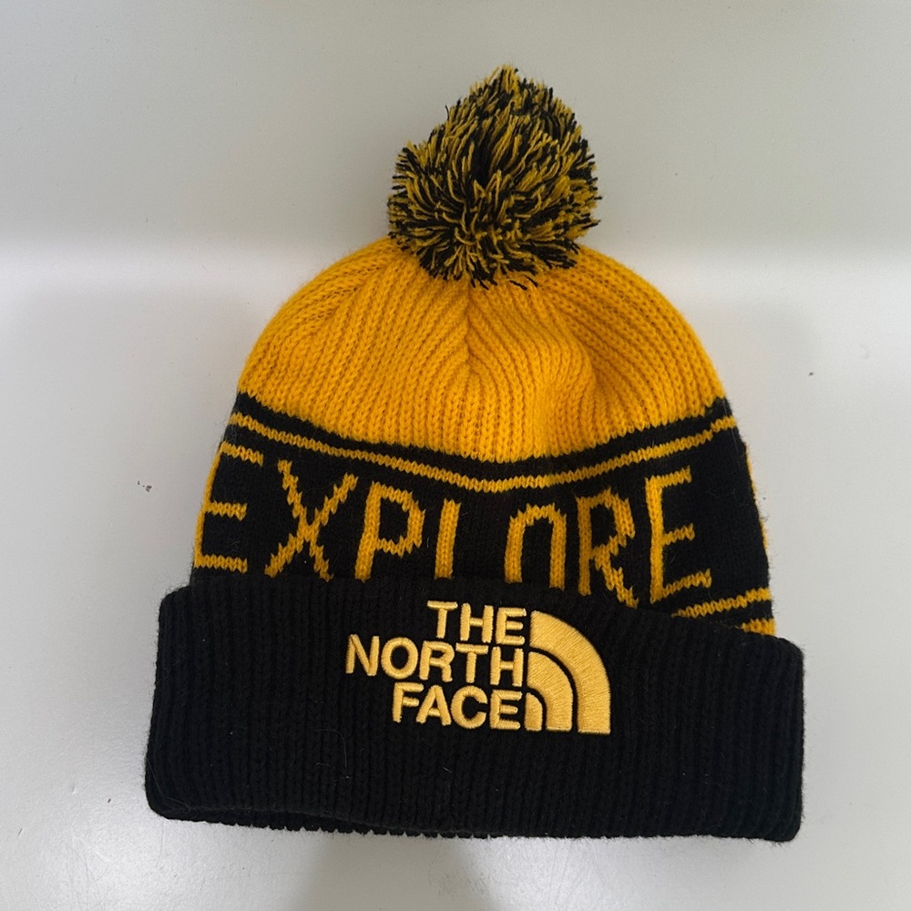 The North Face Yellow and Black Pom-Pom Beanie